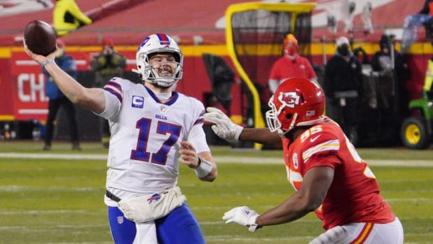 Bills quarterback Josh Allen (17) is pressured by Kansas City Chiefs defensive tackle Chris Jones (95) during the third quarter of the AFC Championship Game at Arrowhead Stadium.